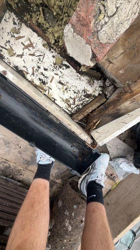 Rotten fascia and gutter before replacement