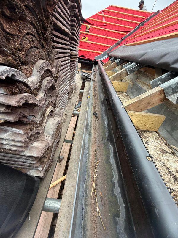 Gutter line on a roof being stripped