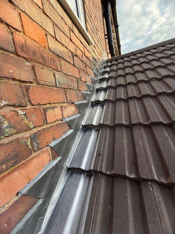 Lead flashing where a roof meets a wall