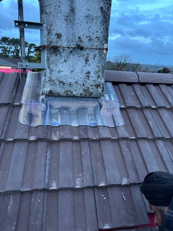 New lead apron at the base of a chimney