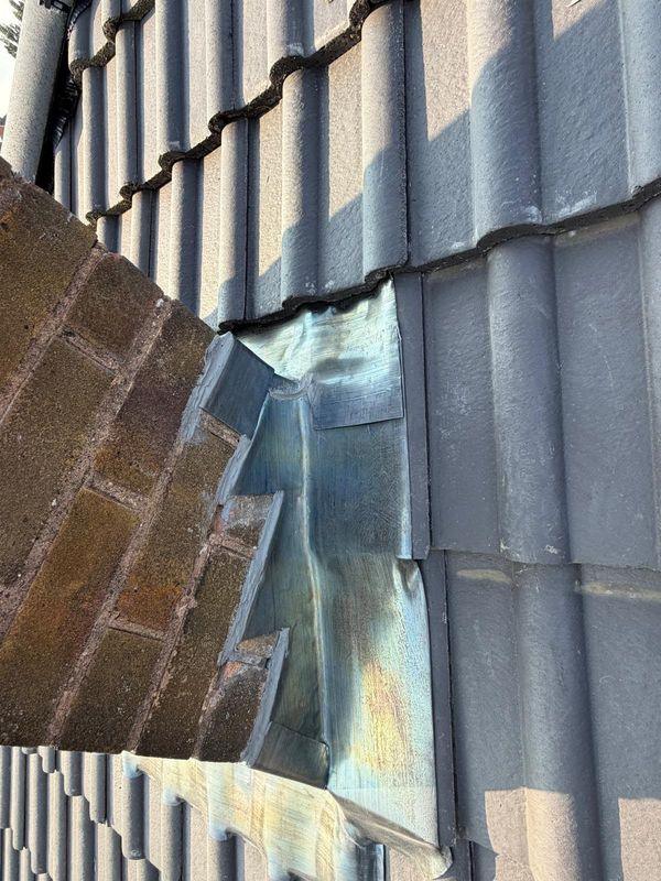 Lead soakers against a chimney