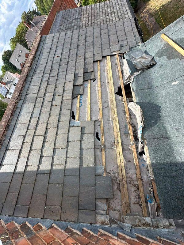 Slate roof repair in progress
