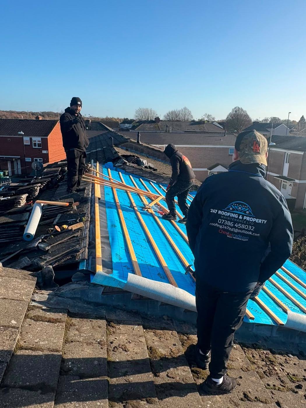 The 247 Roofing team at work on a re-roof