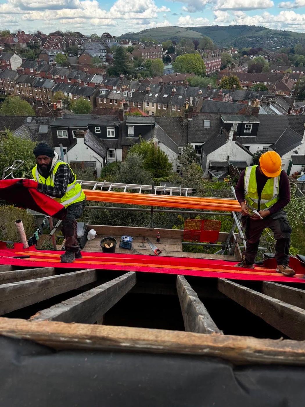 The 247 Roofing team at work on a roof