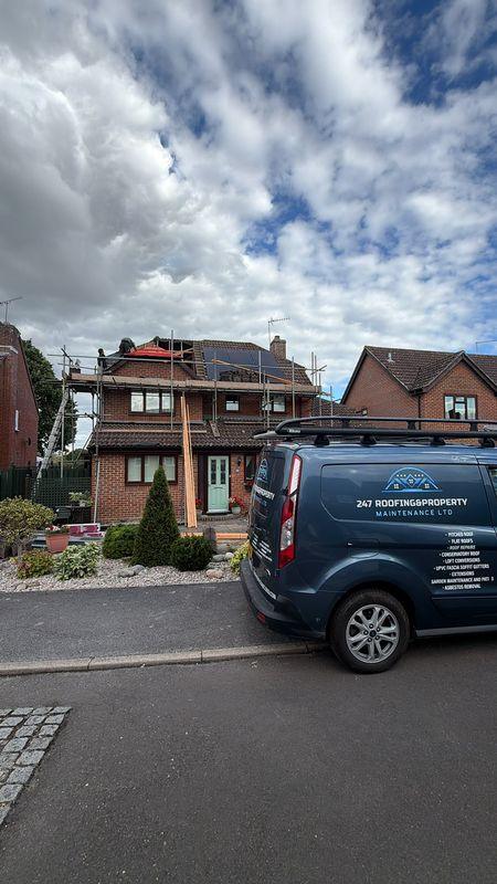 The 247 Roofing van outside a job